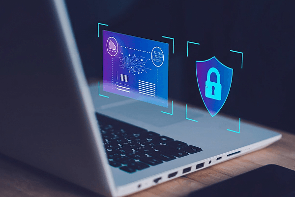 A person typing on a laptop with a screen that is revealing an issue and a lock icon.