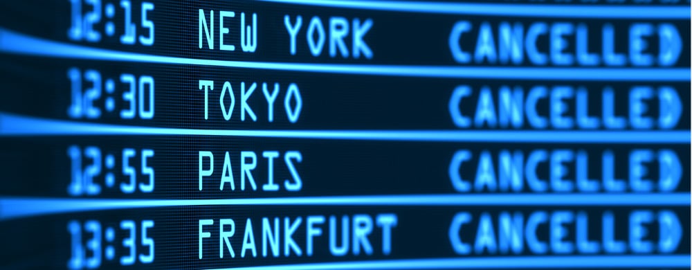 Airport departure board showing four flights to New York, Tokyo, Paris, and Frankfurt all marked.