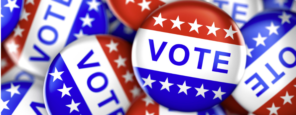 Multiple red, white, and blue campaign buttons with "VOTE" text and stars.