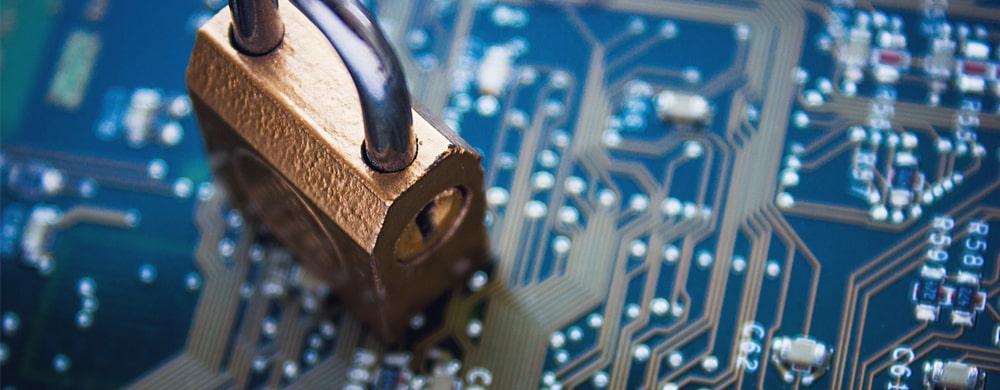 Padlock on a blue circuit board representing cybersecurity and data protection.